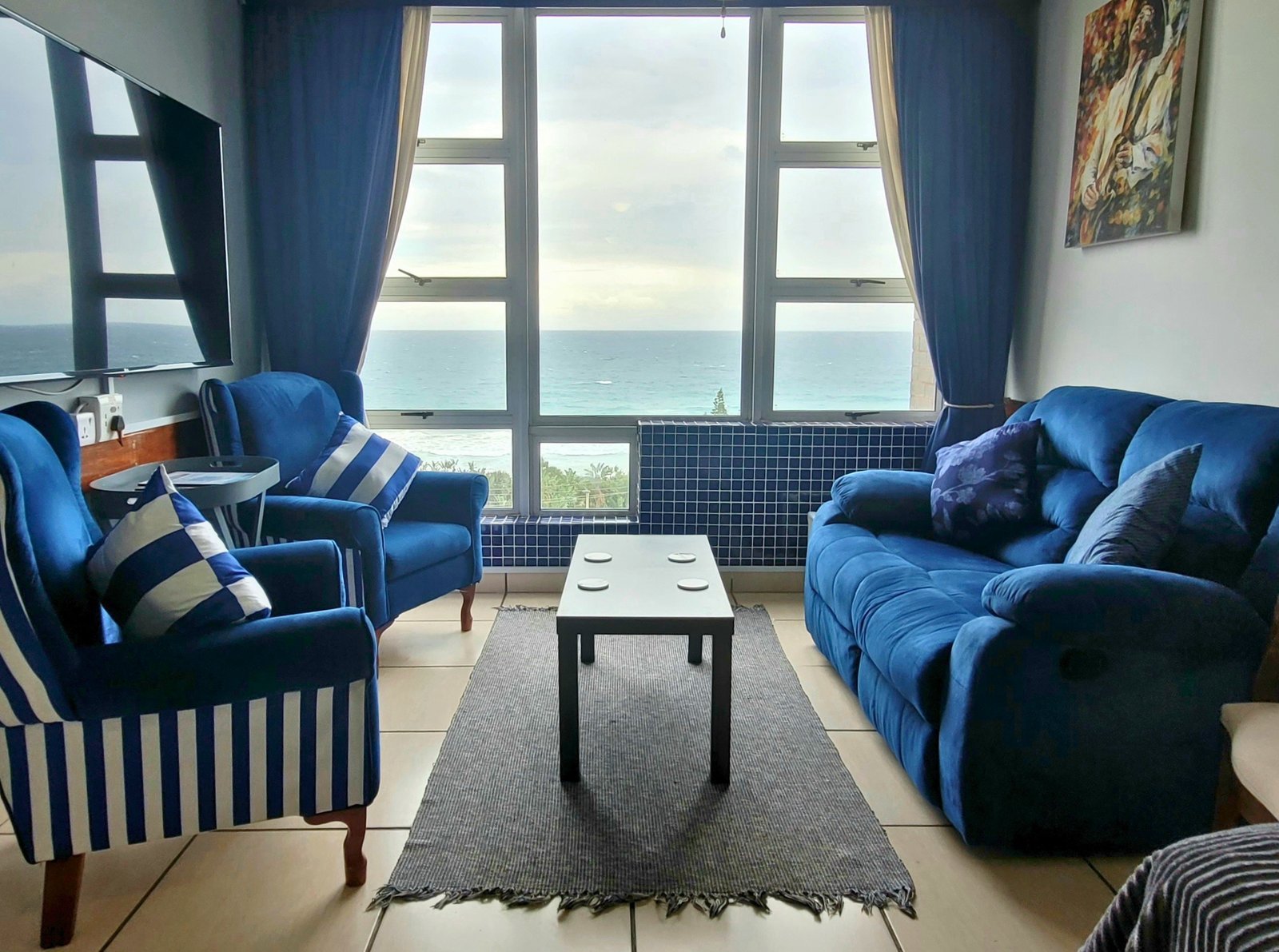 Piece of Paradise — open lounge with ocean-view windows