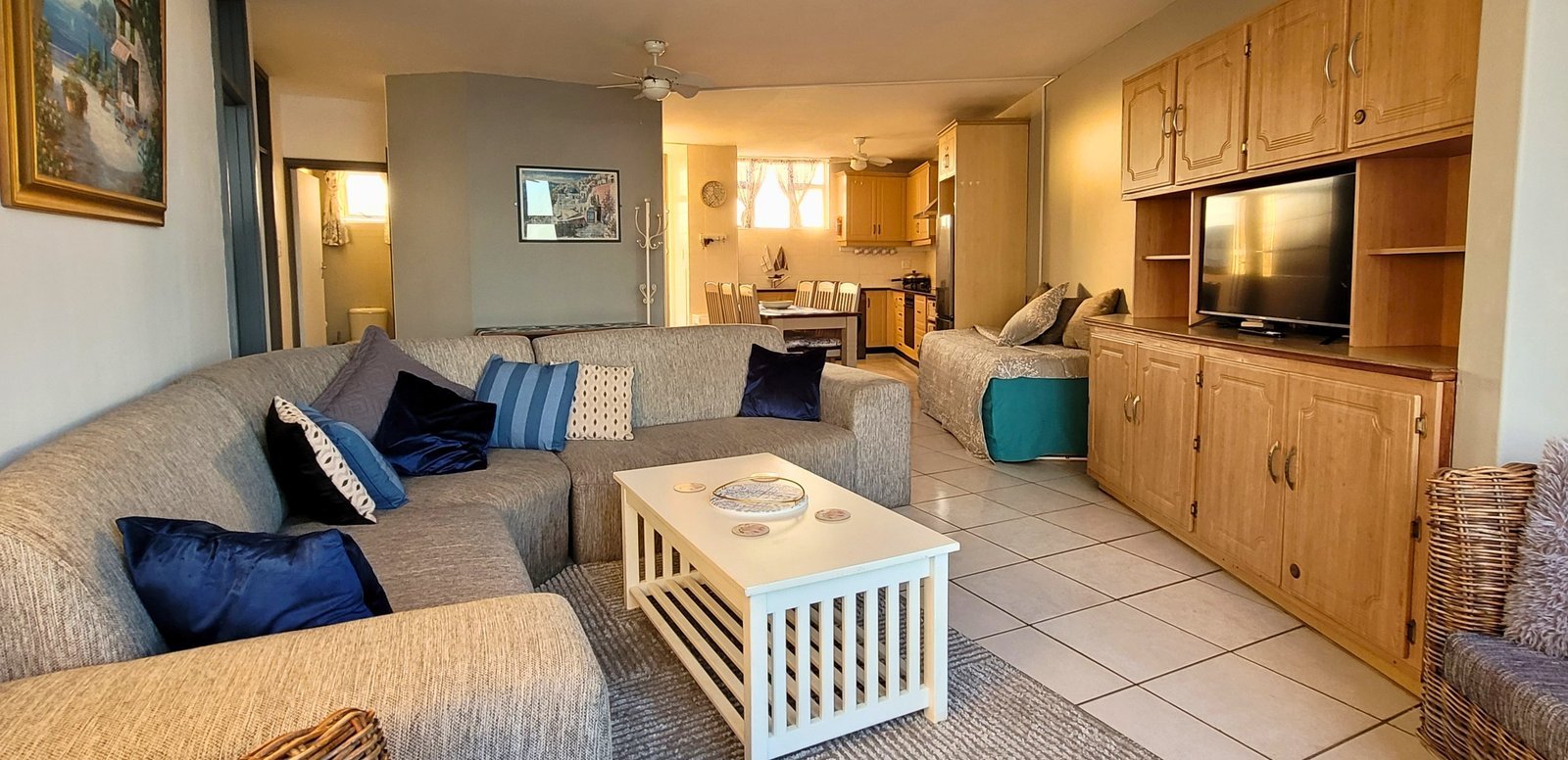 Topdeck Haven — spacious lounge with twin ocean-view windows